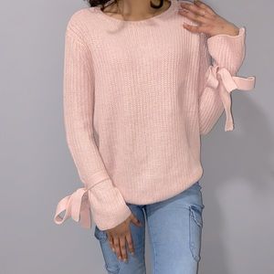 Women’s baby pink knit sweater with bow cuffs!